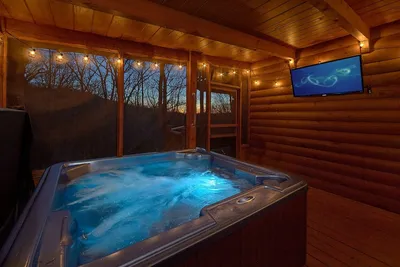 Image de Experience an amazing themed cabin with theater room close to all the fun!