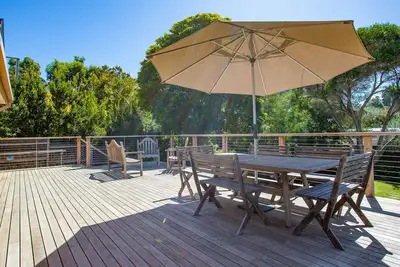 Image de Renovated House with large Northerly facing Sun Deck & Private outlook.