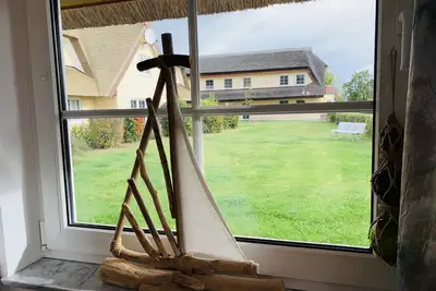 Image de Reethaus Boddenblick in Alt Reddevitz with parking lot, ground-level terrace, Wgh12