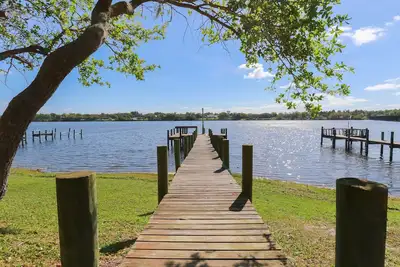 Riverfront Retreat, Private Docks, on Small Acreage.