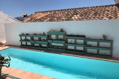 Image de Two big houses with pool nestled into foot of the mountain
