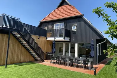 Image de Fh Magnolia - roof terrace, garden, sun loungers, barbecue, fireplace, sauna, close to the Bodden