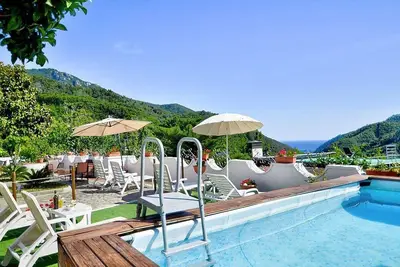 Image de Casa Trifone B: A graceful apartment that is part of a villa surrounded by the greenery, with Free Wi-Fi.
