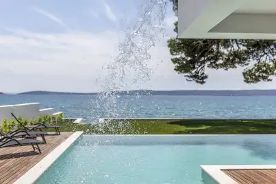 Villa Sea Star - seafront beach with heated 80m2 pool, Bbq and car garage.