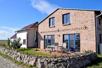 Image de Ferienhaus zum Boddenstrand mit Kamin