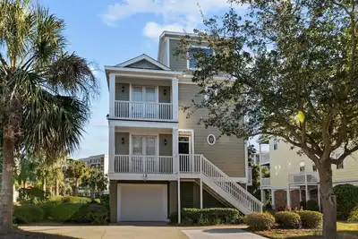 Home with 2 screen porches, 3 decks and captains deck with ocean view.