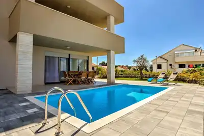 Image de Joli appartement pour 6 personnes avec climatisation, Wifi, piscine privée, Tv et terrasse