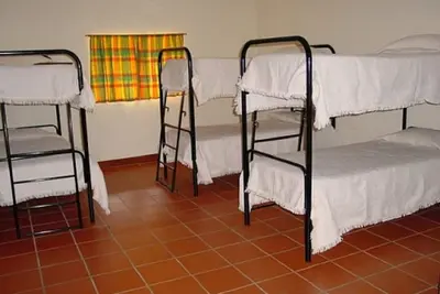 Image de Quarto16 Pessoas. Casa de Banho Privativa no Corredor