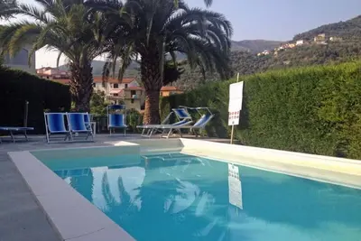 Image de Part of a villa with pool.