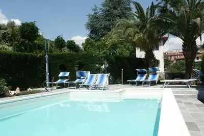 Image de Part of a villa with pool.