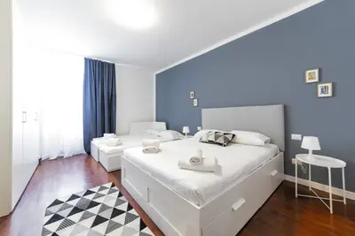 Image de The apartment is located on the third floor of a building without a lift. It comfortably accommodates 4 people in 60 mqs, , with a double bed, two single beds and a sofa bed in the living room. The accommodation is strategically located, a 5-minute walk