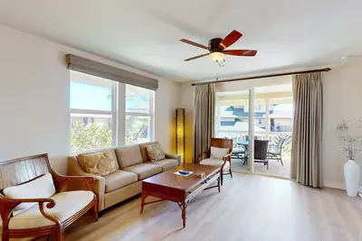 Upscale coursefront condo with partial Ac, shared outdoor pool - close to beach