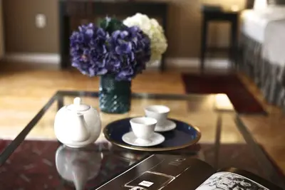 Image de Luxurious sunlit suite in a prime location with a private city-view balcony, A/C
