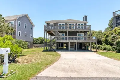 5 bedroom, 3 full bath, 2 1/2 bath home, just steps from the beach on quiet road