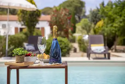 Image de Magnolia - Il Casale Del Sole: villa with swimming pool surrounded by greenery