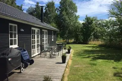Image de Only 400 meters from the water is this lovely and cozy holiday home in a lovely area.