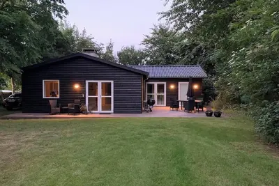 Image de In the charming coastal town of RĂĄgeleje, this lovely holiday home is located.