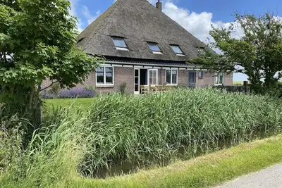 Image de Spacious vacation home in farmhouse, only 2 km from beach in nature reserve.