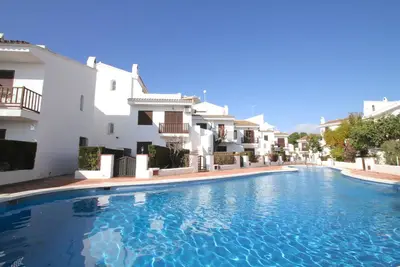 Image de Caleta adosado 1ª línea del mar, piscina comun