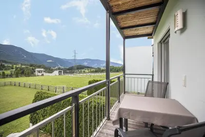 Image de Appartement \"Kronsun - Harmonie\" avec vue sur les montagnes, Wi-Fi, balcon et jardin
