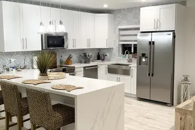 Waterfront  with a pool & private beach access.