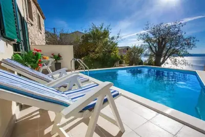 Image de Maison de vacances pour 4 personnes  + 1 enfant env. 80 qmà Gornje Tučepi, Dalmatie (Biokovo)