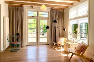 Attractive and luxurious holiday villa in Oostkapelle near the beach, with a large garden with tennis court and plenty of play opportunities
