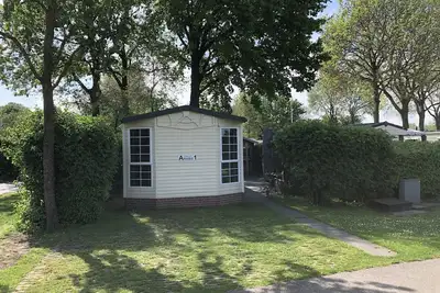 Image de Super cozy chalet on vacation park with lots of water and nature