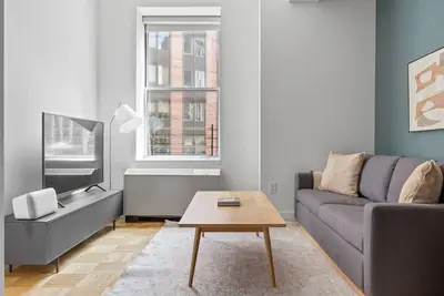Image de Sharp Wall Street 1br w/ Gym, Doorman, Roof deck by Blueground