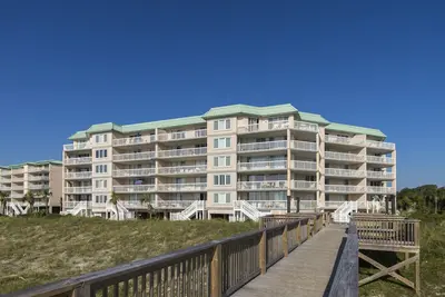 Oceanfront condo with private stairs from balcony in gated Pawleys Island community.
