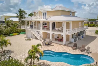 Extraordinary waterfront custom home, pool, 56'dock, ice machine, kayaks, bikes, ect