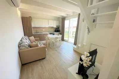 Two-story three-room apartment within walking distance of the sea, in a serviced area, with two balconies