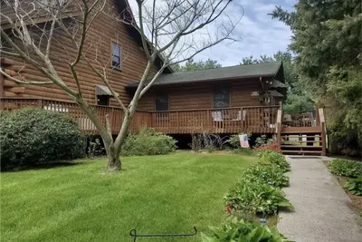 Image de Spectacular Log Home Estate North Wing Apt