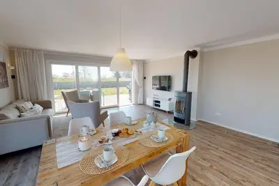 Beachfront 90 m² vacation apartment with large terrace and fireplace for 4 people