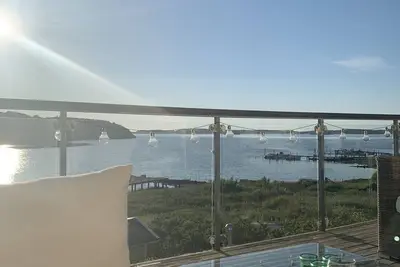 Image de Design beach house with beautiful sea view, lounge terrace and jacuzzi