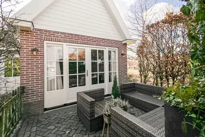 Image de Maison de vacances א Medemblik avec jardin