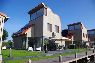 Image de Vacation home on the water with boat, air conditioning, sauna, bike, Sup and Bbq