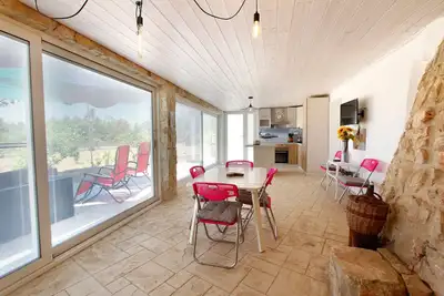 Image de Characteristic Trullo surrounded by greenery near sandy beaches