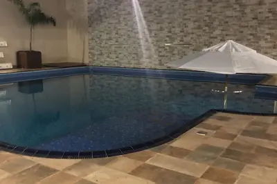 Image de Casa com vaga para 3 carros, área de churrasco com piscina grande.