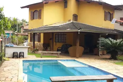 Cozy beach house with beautiful green area and mountains in a gated community