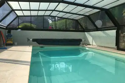 Image de rez de jardin 100m2 vue mer, piscine, 2 ch.