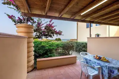 Image de Maison de vacances \"Pergola 708\" à quelques mètres de la plage avec climatisation et terrasse privée