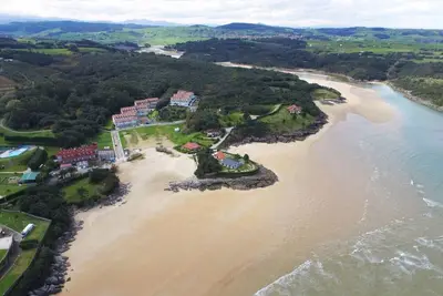 Image de Dúplex primera línea con piscina, tenis y vistas al mar La Arena 4607