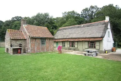 Image de Maison de vacances Het Boerderijtje avec trampoline