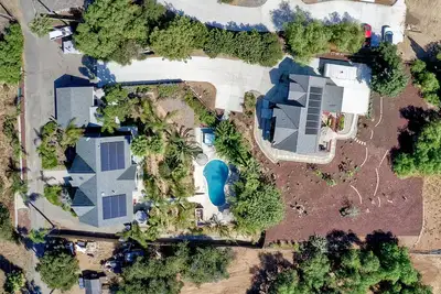 Image de Two Homes, One\n Lot Sleeps 18, Pool & Hot Tub Private Villa, 9 miles from beach.