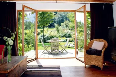 Image de Romantic wooden house with swimming pond, directly on the children's ski slope