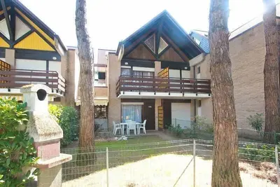 Image de Maison de vacances Lignano Pineta pour 1 - 6 personnes avec 2 chambres à coucher - Maison mitoyenne