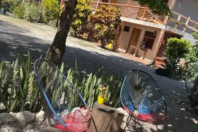 Image de A rustic lodge surrounded by garden, nestled in a jungle setting - double Room 1