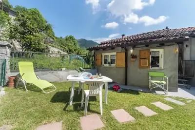 Image de Maison de vacances \"Erve Come una Volta\" avec vue sur montagne et jardin