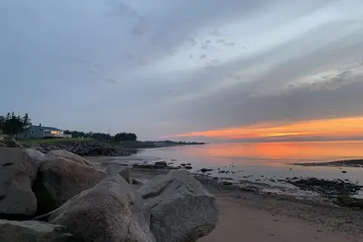 Image de Oceanfront beach cottage panoramic views spectacular sunsets sandbars warm water